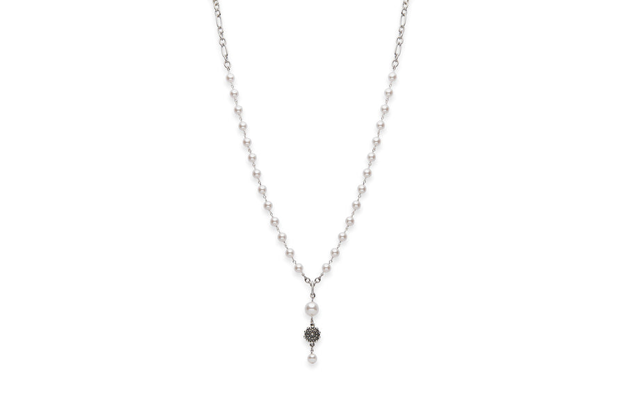 Long pearl necklace with flower accent