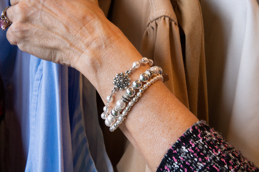 Pearl and flower bracelet on woman