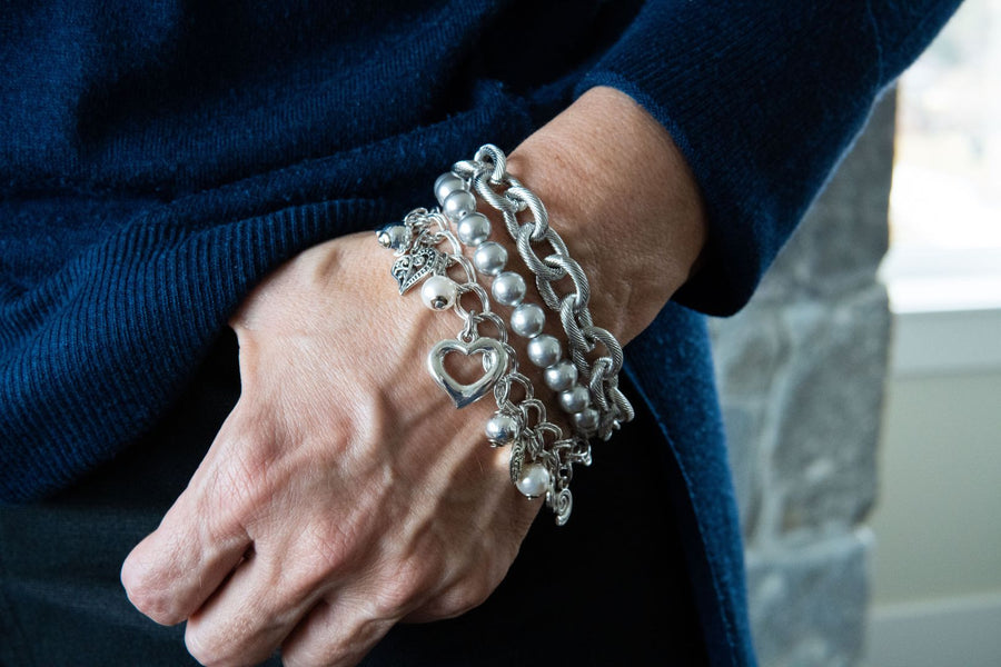 Grey pearl bracelet on woman's wrist