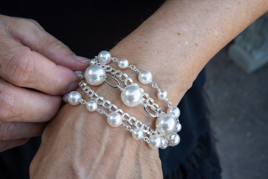 Sterling silver and pearl bracelet on woman's wrist