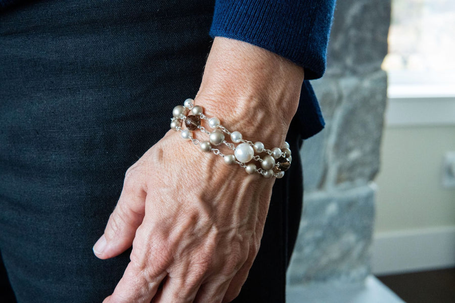 Platinum pearl bracelet on woman