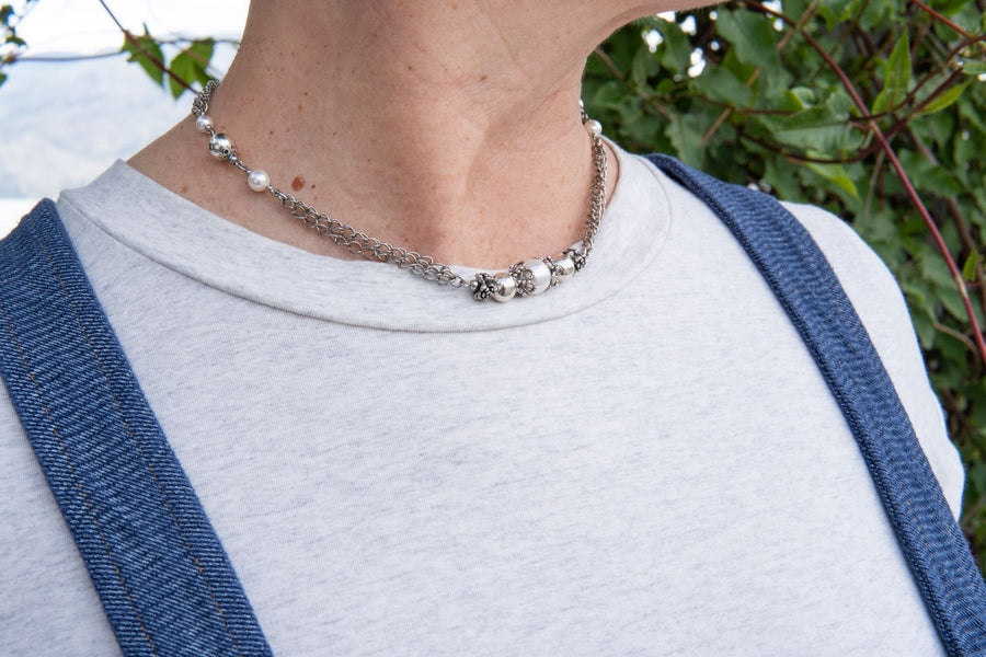 Antique silver and pearl necklace on woman