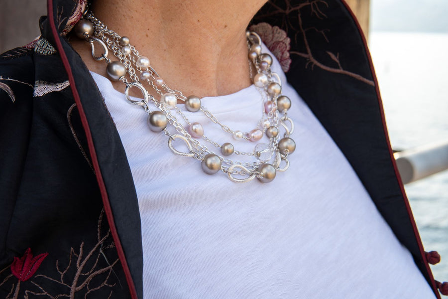 Champagne and pink pearl necklace on woman