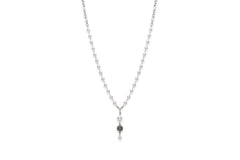 Long pearl necklace with flower accent