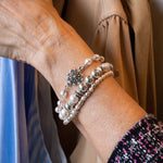 Pearl and flower bracelet on woman