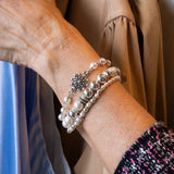 Pearl and flower bracelet on woman