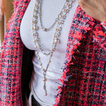 Multiple long pearl and chain necklaces