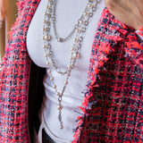 Multiple long pearl and chain necklaces