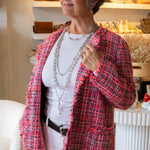Multiple long pearl and chain necklaces on woman