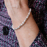 Pearl and silver bead stretch bracelet on woman