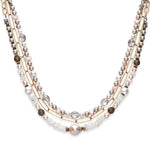 Multi strand pearl and gold chain necklace