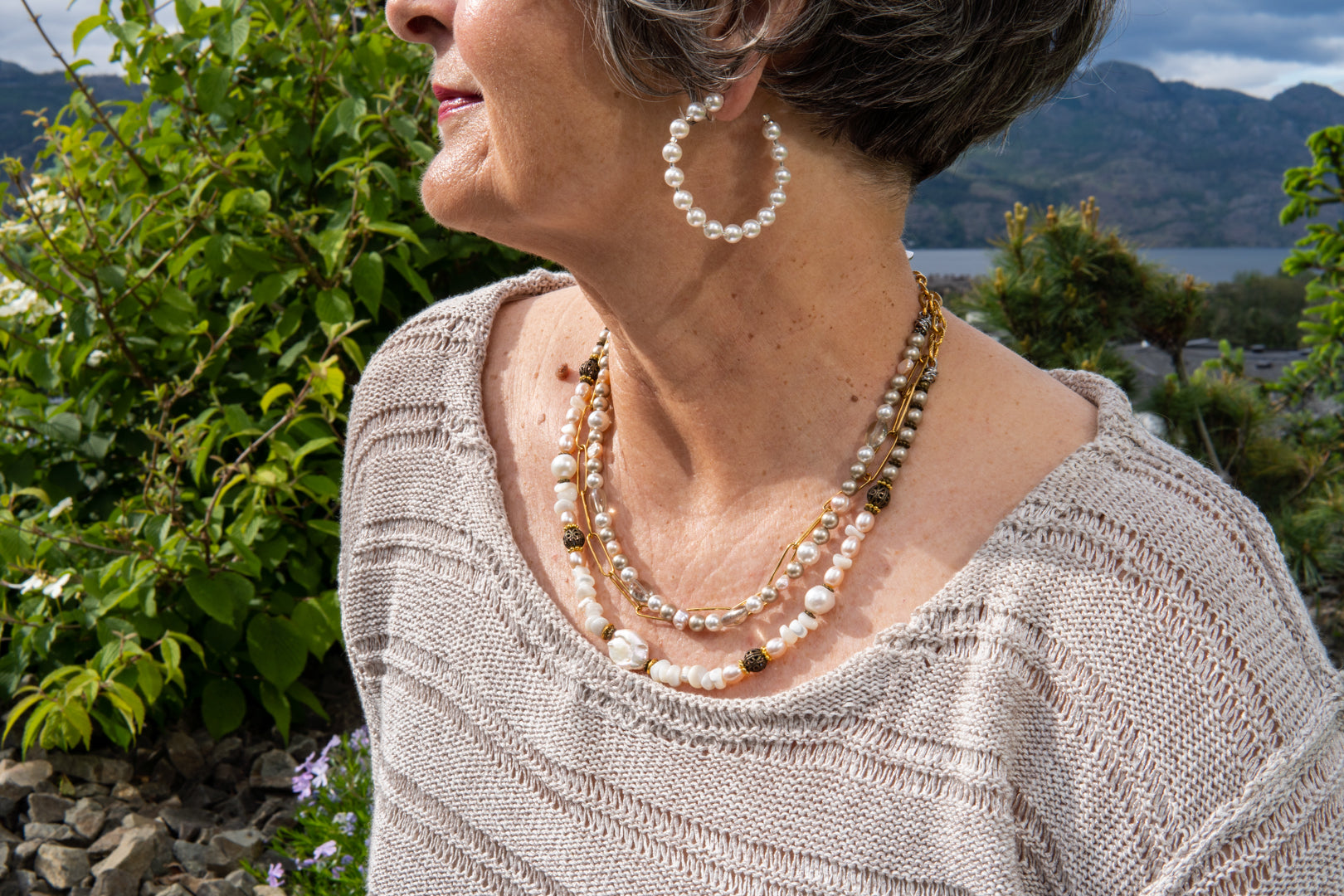 Multi strand pearl and gold chain necklace