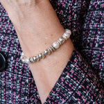 Pearl and silver bead stretch bracelet on woman