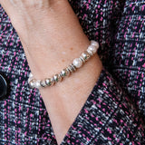 Pearl and silver bead stretch bracelet on woman