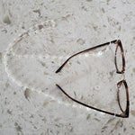 Silver and pearl eyeglass chain with glasses
