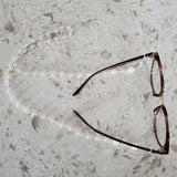 Silver and pearl eyeglass chain with glasses