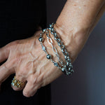 Silver multi strand bracelet on woman's wrist