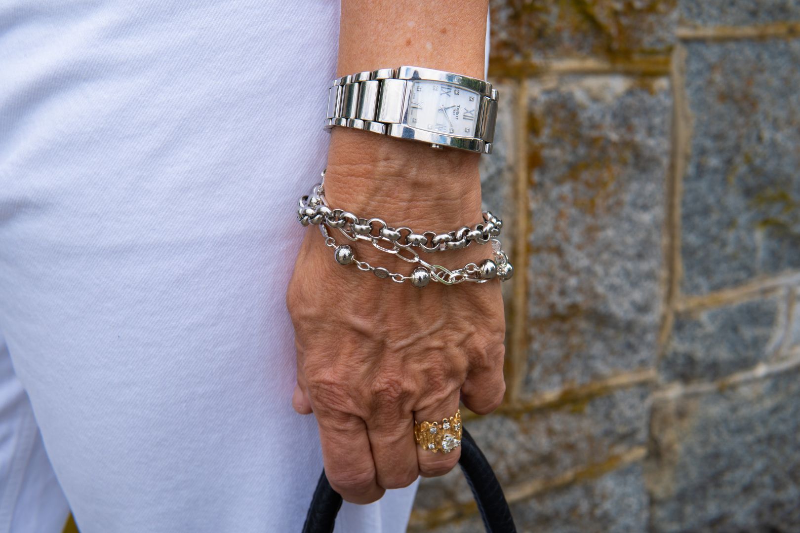Silver multi strand bracelet on woman's wrist