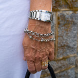 Silver multi strand bracelet on woman's wrist