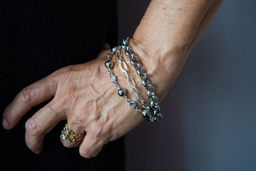 Silver multi strand bracelet on woman's wrist
