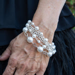 Sterling silver and pearl bracelet on woman's wrist