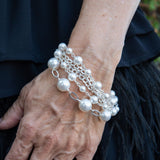 Sterling silver and pearl bracelet on woman's wrist