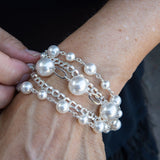 Sterling silver and pearl bracelet on woman's wrist