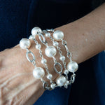 White pearl and chain bracelet on woman