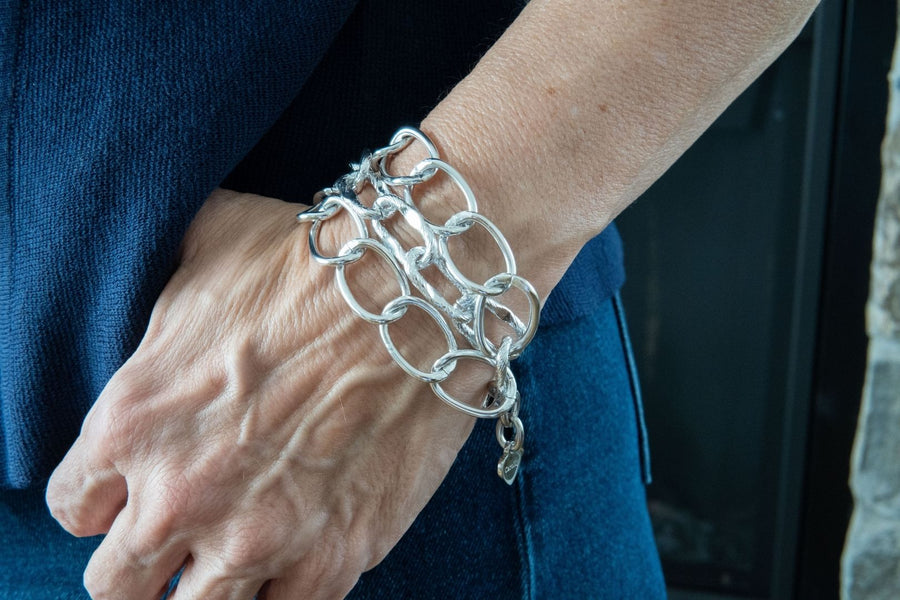 Aluminum chain bracelet on woman's wrist