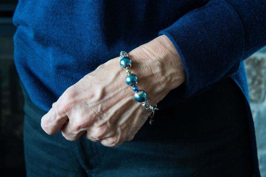 Blue pearl and gemstone bracelet on woman's wrist