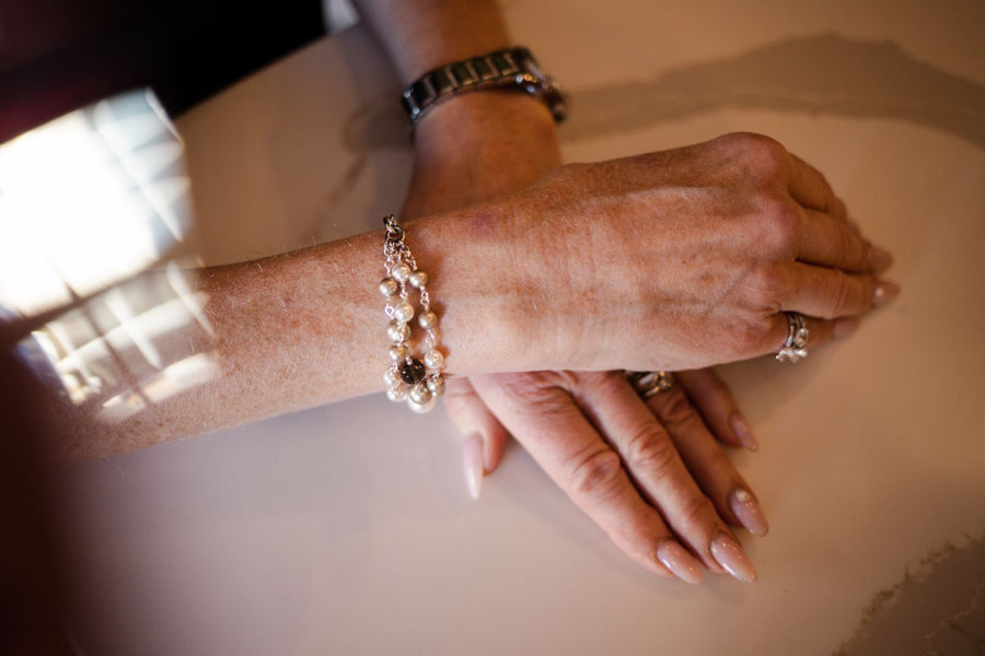 Platinum pearl bracelet on woman