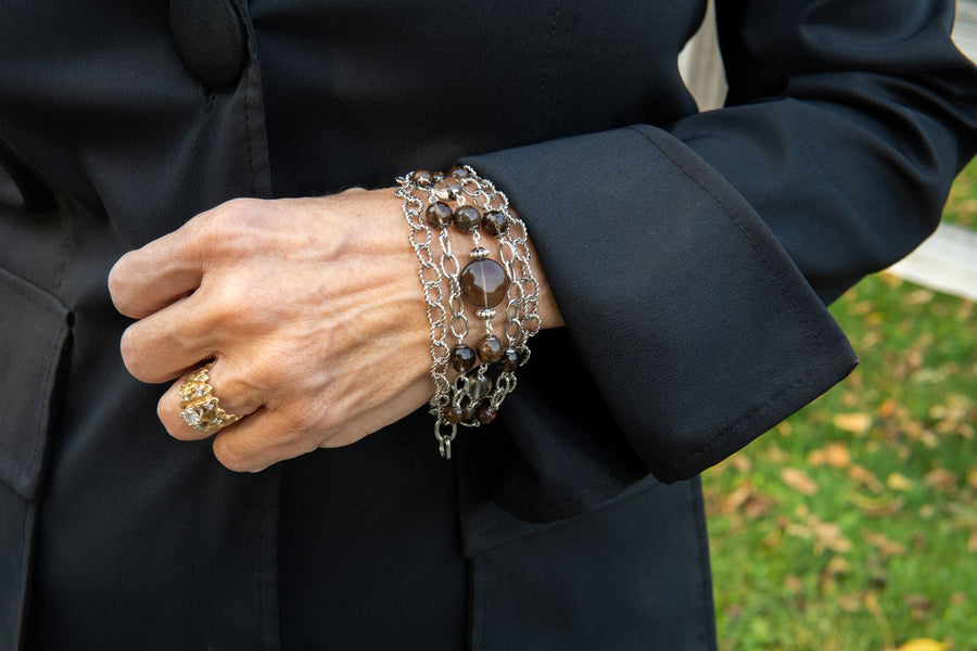 Gemstone bracelet with silver chain on woman's wrist