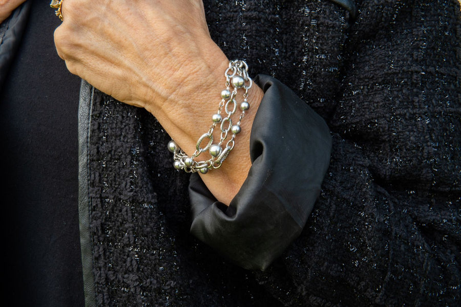Pearl and silver bracelet on woman's wrist