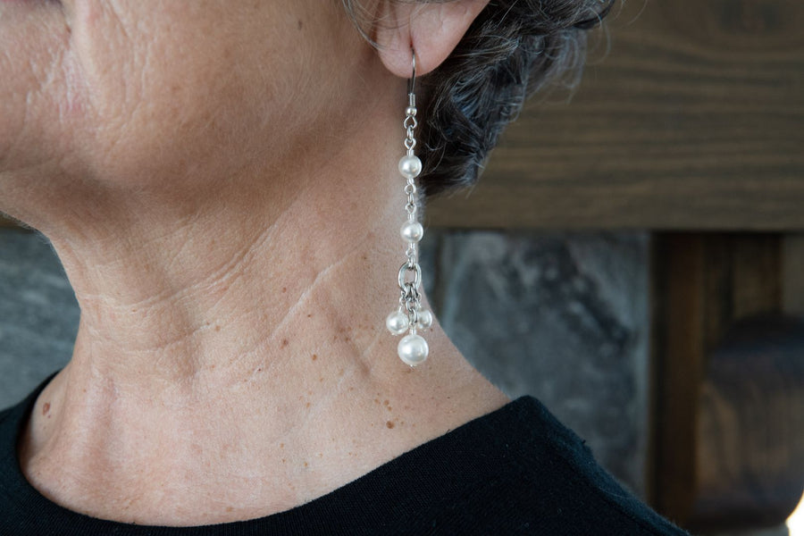 Long white pearl earrings
