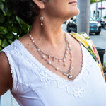 Long white pearl necklace