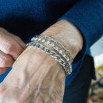 Chain and crystal bracelet on woman's wrist