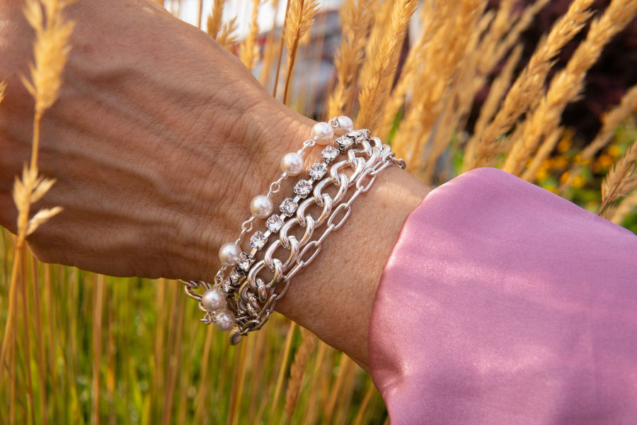 Silver and European crystal pearl bracelet on woman's wrist