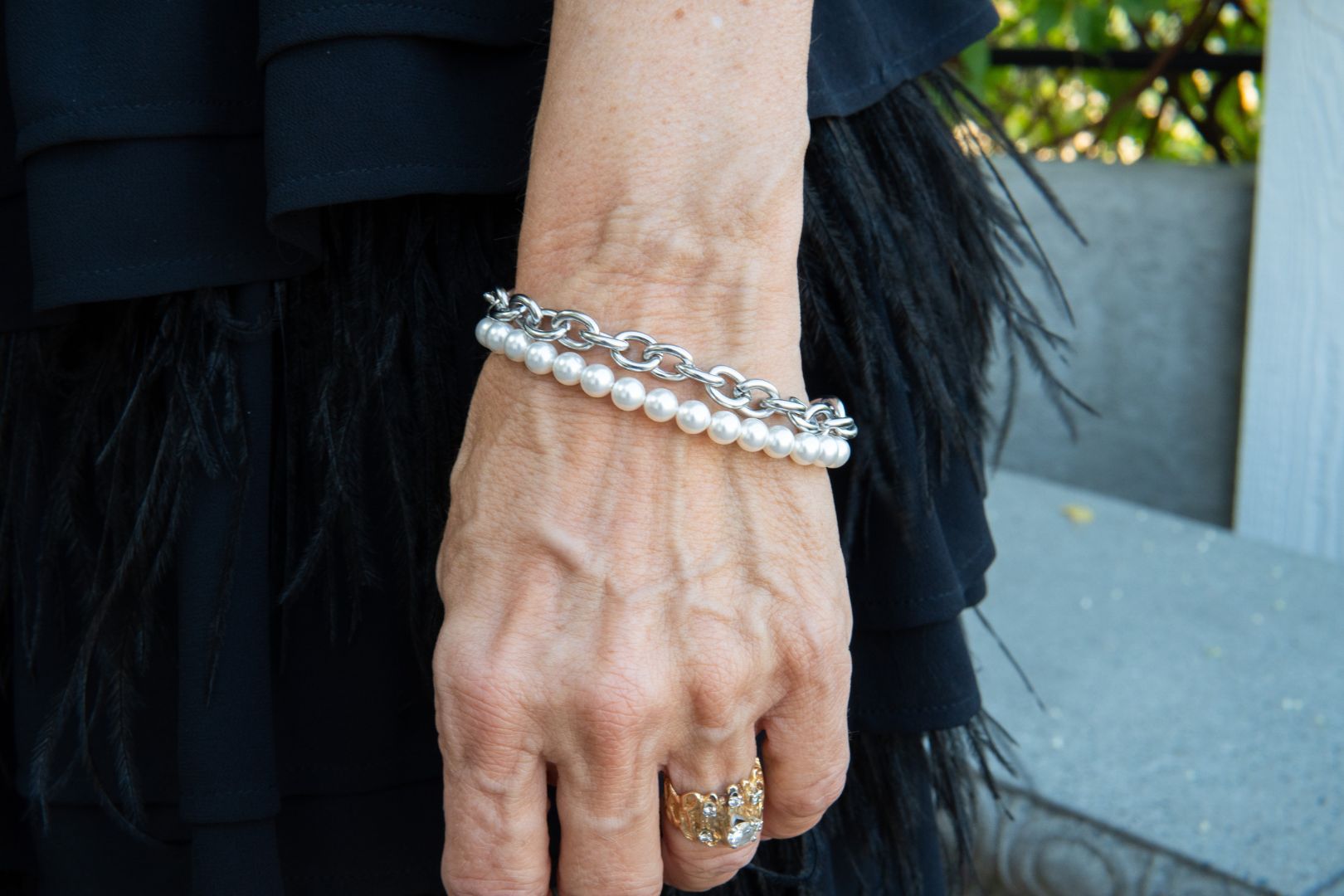Chain and white pearl bracelet with a heart charm