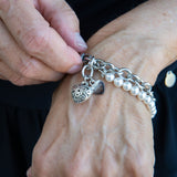 Chain and white pearl bracelet with a heart charm