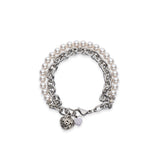 Chain and white pearl bracelet with a heart charm
