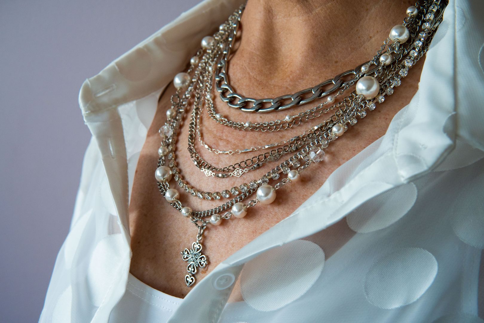 Silver, pearl and cross statement necklace