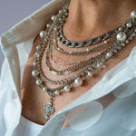 Silver, pearl and cross statement necklace