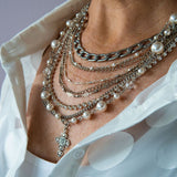 Silver, pearl and cross statement necklace