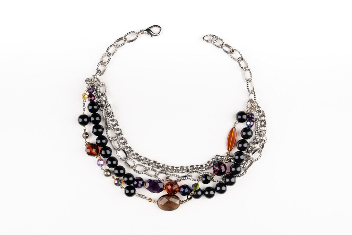 a Carolily Finery necklace made from silver chain, black onyx, various gemstones and Swarovski crystal