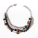 a Carolily Finery necklace made from silver chain, black onyx, various gemstones and Swarovski crystal