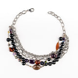 a Carolily Finery necklace made from silver chain, black onyx, various gemstones and Swarovski crystal