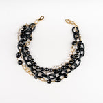 a Carolily Finery statement necklace made from onyx, Swaorvski crystal, gold plated chains and pearls