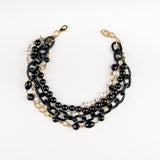 a Carolily Finery statement necklace made from onyx, Swaorvski crystal, gold plated chains and pearls